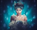 Beautiful ice queen in a falling snow Royalty Free Stock Photo