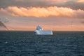 Beautiful iceberg floating in the water. Photo taken at sunset in Antarctica and Arctic Greenland. Global warming and