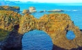 Beautiful icelandic coastal landscape, natural stone arch bridge, ocean bay - Dyrholaey, Iceland