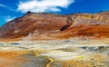Beautiful icelandic colorful volcanic nature landscape valley, yellow sulfur deposits, red mountains, steaming hot ground - Royalty Free Stock Photo