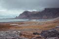 Beautiful icelandic landscape in early morning. Yellow grass, sunrise, clouds and bay in the distance. Very beautiful scenery Royalty Free Stock Photo