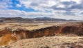 Beautiful Icelandic landscape - Field under a Blue Sky with Mountains in the Distance Royalty Free Stock Photo