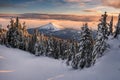 Beautiful icy sunset, clouds and frozen snow-capped mountains. Royalty Free Stock Photo