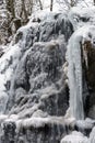 Beautiful icy waterfall in the forest. Vosges mountains. Royalty Free Stock Photo