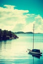 Beautiful idyllic lake landscape, swimming drifting yacht Royalty Free Stock Photo