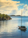 Beautiful idyllic lake landscape, swimming drifting yacht Royalty Free Stock Photo