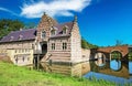 Beautiful idyllic scenic water moat with medieval castle and bridge - Kasteel Heeswijk, Netherlands Royalty Free Stock Photo