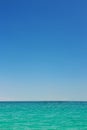 Beautiful idyllic seascape with blue sky. Clear sky and calm sea or ocean water surface background Royalty Free Stock Photo