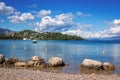 Beautiful idyllic summer landscape with calm sea, boat, blue sky and white clouds Royalty Free Stock Photo