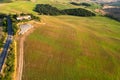 Beautiful idyllic summer landscape of Toscana with many mediterranean plants, hills, trees and fields.