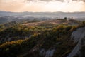 Beautiful idyllic sunny late summer landscape of Toscana with hills, trees, fields and forests. Evening or morning in Italy. Royalty Free Stock Photo
