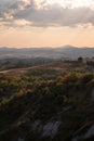 Beautiful idyllic sunny late summer landscape of Toscana with hills, trees, fields and forests. Evening or morning in Italy. Royalty Free Stock Photo