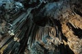 Beautiful illuminated cave formations and stalactites inside of
