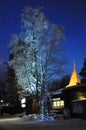 Beautiful illuminated tent and tree in Finnish Lapland