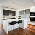 A contemporary kitchen is sleek and spotless