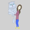 a girl holds a big cat in her arms