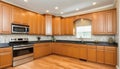 Wonderful kitchen area with honey-colored cabinetry