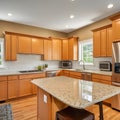 Wonderful kitchen area with honey-colored cabinetry