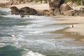 image of the beach captured the moment when one surfer leaves and another enters the water Royalty Free Stock Photo