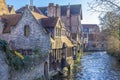 Beautiful image of brick houses next to a canal with a blue sky Royalty Free Stock Photo