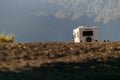 Beautiful image of camping car with green mountains on the background. . Taken at lake todos los santos in Vicente Perez Rosales