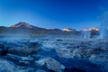 Beautiful image of hot steams and smoke columns making rivers of sulfured water. Taken at sunrise in Geysers of Tatio at Los