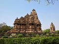 Beautiful image of Kandariya Mahadeva temple, Khajuraho, Madhyapradesh, India with blue sky and fluffy clouds in the Royalty Free Stock Photo