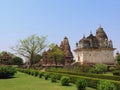 Beautiful image of Kandariya Mahadeva temple, Khajuraho, Madhyapradesh, India with blue sky and fluffy clouds in the background, Royalty Free Stock Photo