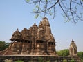 Beautiful image of Kandariya Mahadeva temple, Khajuraho, Madhyapradesh, India with blue sky and fluffy clouds in the background, Royalty Free Stock Photo