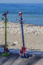 Beautiful image of Mexican toys, two small replicas of Papantla Flyers or flying pole made in wood