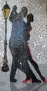 Beautiful image in a mural of Argentine tango dancers with a lantern behind Buenos Aires Argentina