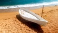 Beautiful photo of old white wooden boat lying on the sea shore. Fesherman boat on the beach Royalty Free Stock Photo