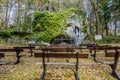 Image of outdoor benches in front of the replica of the Virgin of Lourdes Royalty Free Stock Photo