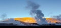 Beautiful image of people observing geysers throwing steam. Taken at the sunrise in Geysers of Tatio at Los Flamencos national