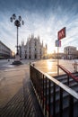 Beautiful image of Piazza Duomo of Milan at sunrise with railing in foreground Royalty Free Stock Photo