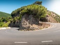 Beautiful image of sharp hairpin road turn in the mountains