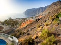 Beautiful image of small town and high cliffs and mountains at the ocean Royalty Free Stock Photo