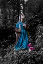Image of a statue of Bernadette praying to Our Lady of Lourdes