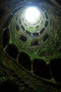 A beautiful image of the wall of a tower with windows and stairs from inside