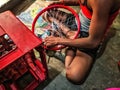 Beautiful image of a worker fitting bycycle rim india