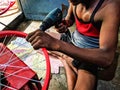 Beautiful image of worker is fitting bycycle rim india