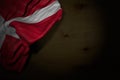 beautiful independence day flag 3d illustration - dark illustration of Denmark flag with big folds on dark wood with free place