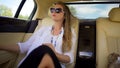 Beautiful independent woman enjoying car trip on vacation, business traveler