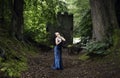 Beautiful Indian Asian girl in blue dress with sultry pose in front of a castle keep Royalty Free Stock Photo