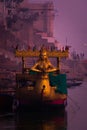 A beautiful indian boat of golden colors taken in the morning time in Varanasi with selective focus