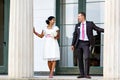 Beautiful indian bride and caucasian groom, in summer park. Happy young woman holding flowers. Young man smiling, Couple Royalty Free Stock Photo