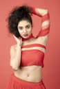 Beautiful indian female model with beautiful blackhair in a red flowy dress dancing