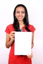 Beautiful Indian girl holding a white banner.