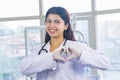 Beautiful Indian Looking Nepali Dentist Doctor Girl Smiling and Giving gestures