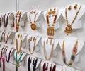 beautiful Indian, Oriental vintage women's gold earrings on shop window.